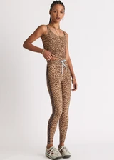 THE UPSIDE women's animal Panthera 25 Inch Midi Pant is designed for a mid-rise fit and features navy contrast binds down the side seams and a blue elastic drawcord. Made for yoga and pilates.