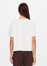 THE UPSIDE women’s natural Elina V Neck Tee is a boxy-fit style featuring a mini chest patch pocket and ribbed neckline with chocolate piping. Made for lifestyle.
