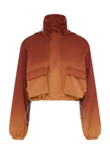 THE UPSIDE women's red Maya Ace Shell Jacket is designed for a cropped fit and features water-resistant, moisture-wicking, quick-dry fabric with four-way stretch. Made for running.
