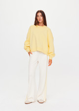 THE UPSIDE women's yellow organic cotton Paloma Crew is designed for a boxy fit and features a drop shoulder and ribbed neckline, hem and cuffs. Made for lifestyle.