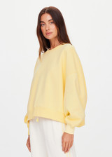 THE UPSIDE women's yellow organic cotton Paloma Crew is designed for a boxy fit and features a drop shoulder and ribbed neckline, hem and cuffs. Made for lifestyle.