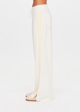 THE UPSIDE women's natural recycled polyester Roma Pant is high rise and features a butter mesh tape along side seams and back pockets with a logo pip. Made for lifestyle.