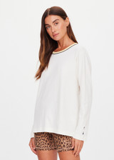 THE UPSIDE women's natural organic cotton Mali Long Sleeve Top is a relaxed fit and features a ribbed neckline in butter with navy piping. Made for lifestyle.