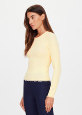 THE UPSIDE women's yellow organic cotton Arlo Pointelle Long Sleeve Top is a soft and comfortable fit and features a crew neck and ruffle lace edge tonal trim. Made for lifestyle.