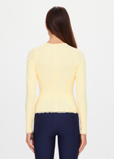THE UPSIDE women's yellow organic cotton Arlo Pointelle Long Sleeve Top is a soft and comfortable fit and features a crew neck and ruffle lace edge tonal trim. Made for lifestyle.