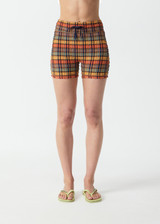 THE UPSIDE women's check Del Sol 4 Inch Spin Short is mid rise and features a navy elastic drawcord with aglets and is fully lined. Made for yoga and pilates.