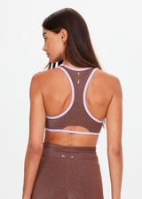 THE UPSIDE women's chocolate metallic Galaxia Danita Racerback Bra is designed for a supportive fit and features a scoop neckline, racerback and removable cups. Made for yoga and pilates.