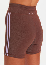 THE UPSIDE women's chocolate metallic Galaxia 4inch Spin Short is mid-rise and features a purple drawcord with aglets and purple rib binds down side seams. Made for yoga and pilates.