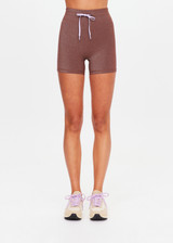 THE UPSIDE women's chocolate metallic Galaxia 4inch Spin Short is mid-rise and features a purple drawcord with aglets and purple rib binds down side seams. Made for yoga and pilates.