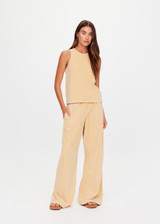 THE UPSIDE women's yellow Soho Tokio Wide Leg Pant is designed for a relaxed fit and features an elasticated waistband, front pockets and embroidered arrow logo. Made for everyday.