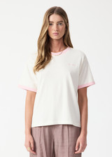 THE UPSIDE women's pink organic cotton Jacob Tee is an oversized fit and features contrast pink binds on sleeves and a small embroidered logo on front chest. Made for lifestyle.