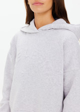 THE UPSIDE women's grey marle Byron Embossed Logo Hoodie is made from an organic cotton with a relaxed boxy shape featuring a tonal embossed horseshoe logo at the front.