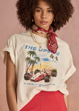 THE UPSIDE women's cream organic cotton Raceway Sammi Tee is designed for an oversized fit with printed raceway graphics on the front.