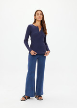 THE UPSIDE women's navy organic cotton Ness Ribbed Long Sleeve Top is designed for a slim fit. The perfect piece for layering and styling up or down.