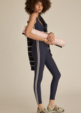 THE UPSIDE women's navy recycled peached Daytona 25 inch Legging is designed for a high-rise supportive fit and features contrast cream binds. Perfect for yoga.