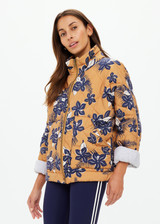 THE UPSIDE women's floral Aruba Quilted Nicola Jacket is designed for an oversized fit and features patch pockets and antique brass zipper. Made for lifestyle.