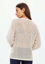 THE UPSIDE women's creme organic cotton Josephine V Neck Knit is a lightweight open knit designed for a relaxed fit with a deep V neckline. Made for everyday.