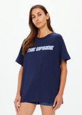 THE UPSIDE women's navy organic cotton Stardust Sammi Tee is designed for an oversized fit and features printed puff logo at front. Made for lifestyle.