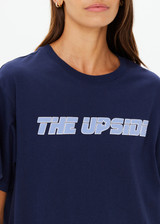 THE UPSIDE women's navy organic cotton Stardust Sammi Tee is designed for an oversized fit and features printed puff logo at front. Made for lifestyle.