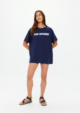 THE UPSIDE women's navy organic cotton Stardust Sammi Tee is designed for an oversized fit and features printed puff logo at front. Made for lifestyle.