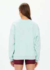 THE UPSIDE women's mint organic cotton Stardust Saturn Crew is designed for a oversized fit and features an embroidered The Upside logo at front with subtle rhinestone detailing.