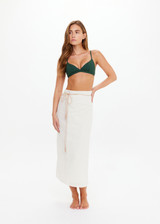 THE UPSIDE women's cream Beach Serenade Wrap Sarong is made from cotton. The beach sarong skirt features vegan leather braided belt. Designed for layering and travel.