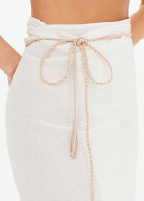 THE UPSIDE women's cream Beach Serenade Wrap Sarong is made from cotton. The beach sarong skirt features vegan leather braided belt. Designed for layering and travel.