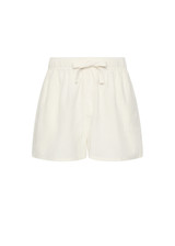 THE UPSIDE women's cream Hotel Du Cap Short is made from tencel linen blend. The elasticated waist short features drawstring. Designed for comfort and travel.