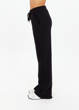 THE UPSIDE women's black organic cotton Willow Wide Leg Pant is a high-waisted, relaxed fit and features an elasticated waistband with drawcord and side seam pockets. Made for lifestyle.