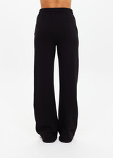 THE UPSIDE women's black organic cotton Willow Wide Leg Pant is a high-waisted, relaxed fit and features an elasticated waistband with drawcord and side seam pockets. Made for lifestyle.