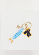 THE UPSIDE multi Seven Keyring with gold metal star and macrame paracord in palme blue and white with rubber dipped ends.