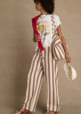 THE UPSIDE women's organic cotton creme Feeling Lucky Jodhi Tee features a classic shape and Feeling Lucky graphic printed on the front chest. Made for everyday wear.