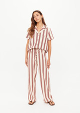 THE UPSIDE women's stripe organic cotton Baja Charli Drawstring Pant is low-rise with a straight leg, soft elastic waistband, and wooden bead ends on drawcord. Made for lifestyle.