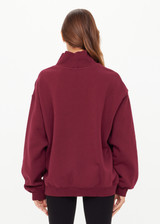 THE UPSIDE women’s maroon organic cotton Le Ski Clementine Crew is designed for an oversized fit and features Le Ski logo print & embroidery on front chest. Designed for Après-ski and winter wear.