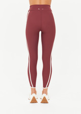 THE UPSIDE women’s red recycled peached Samara 25inch Legging is a soft & supportive fit and features side pockets and contrast cream stripes with curved hem detail. Made for pilates.