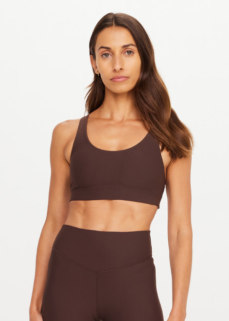 THE UPSIDE women's brown Peached Jade Racerback Bra offers a soft & supportive fit and features removable cups and moisture control properties. Made for yoga & pilates.