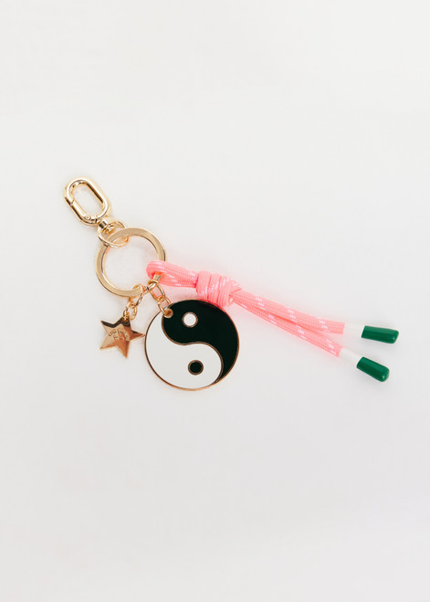 THE UPSIDE multi Yin Yang Keyring charm features a gold metal star, embossed logo and neon pink-white knotted paracord. Made for lifestyle.