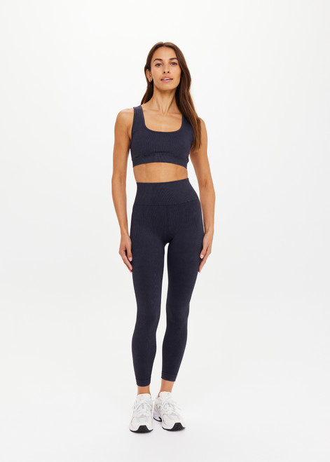 THE UPSIDE women's black Seamless 25inch Midi Pant has a mid-rise waist in rib fabrication. Made for yoga & pilates.
