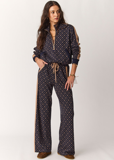 THE UPSIDE women's monogram jacquard Ezra Nova Flare Pant features a monogram geometric design and an elasticated waistband with drawcord. Made for lifestyle.