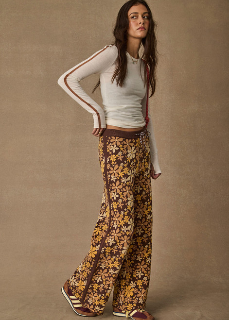 THE UPSIDE women's floral organic cotton Copacabana Juniper Knit Pant offers a soft and supportive fit with a straight leg silhouette, side stripes and drawcord waistband. Made for lifestyle.