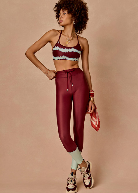 THE UPSIDE women’s tie dye recycled Rio 25inch Midi Legging offers a mid rise, drawcord waist and is printed in supersoft and breathable fabric. Made for yoga and pilates.