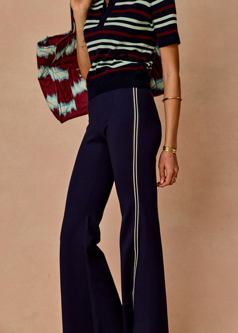 THE UPSIDE women’s navy sustainable Joyela Panelled Flare Pant is mid rise and features an internal elasticated waistband, front and back darts and contrast side stripe tape. Made for lifestyle.