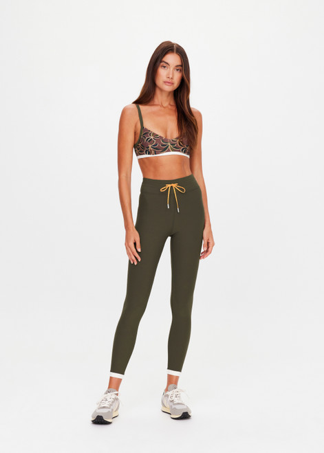 THE UPSIDE women's olive Laguna 25inch Legging offers soft support and features an orange drawcord and contrast cuffs at hem. Made for yoga & pilates.