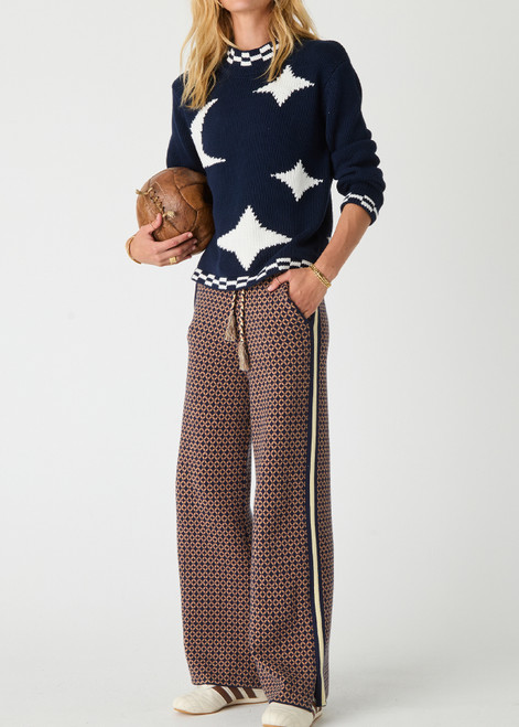 THE UPSIDE women's navy Eternity Clyde boxy Knit Crew Sweater is made with organic cotton and features cream detailing of stars and moons.