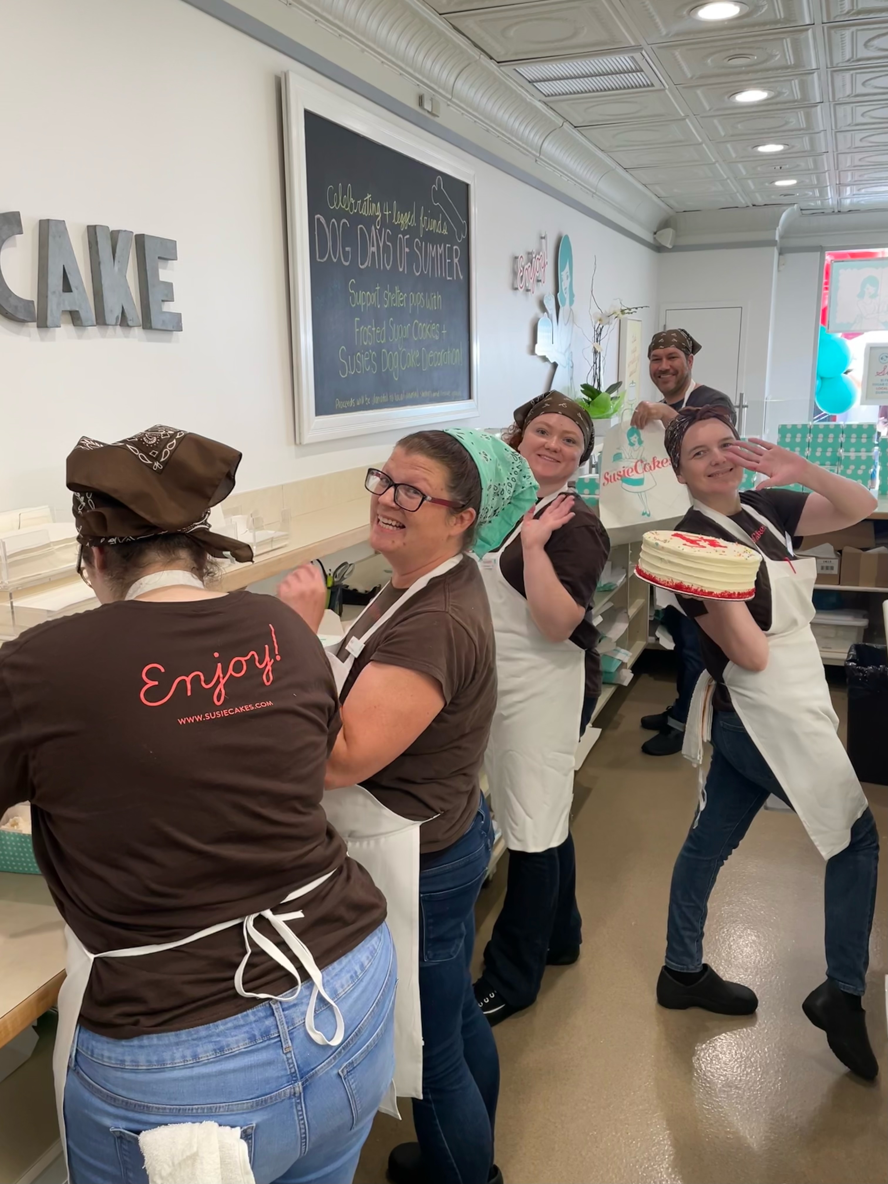 Bakers Decorating Cakes and Smiling