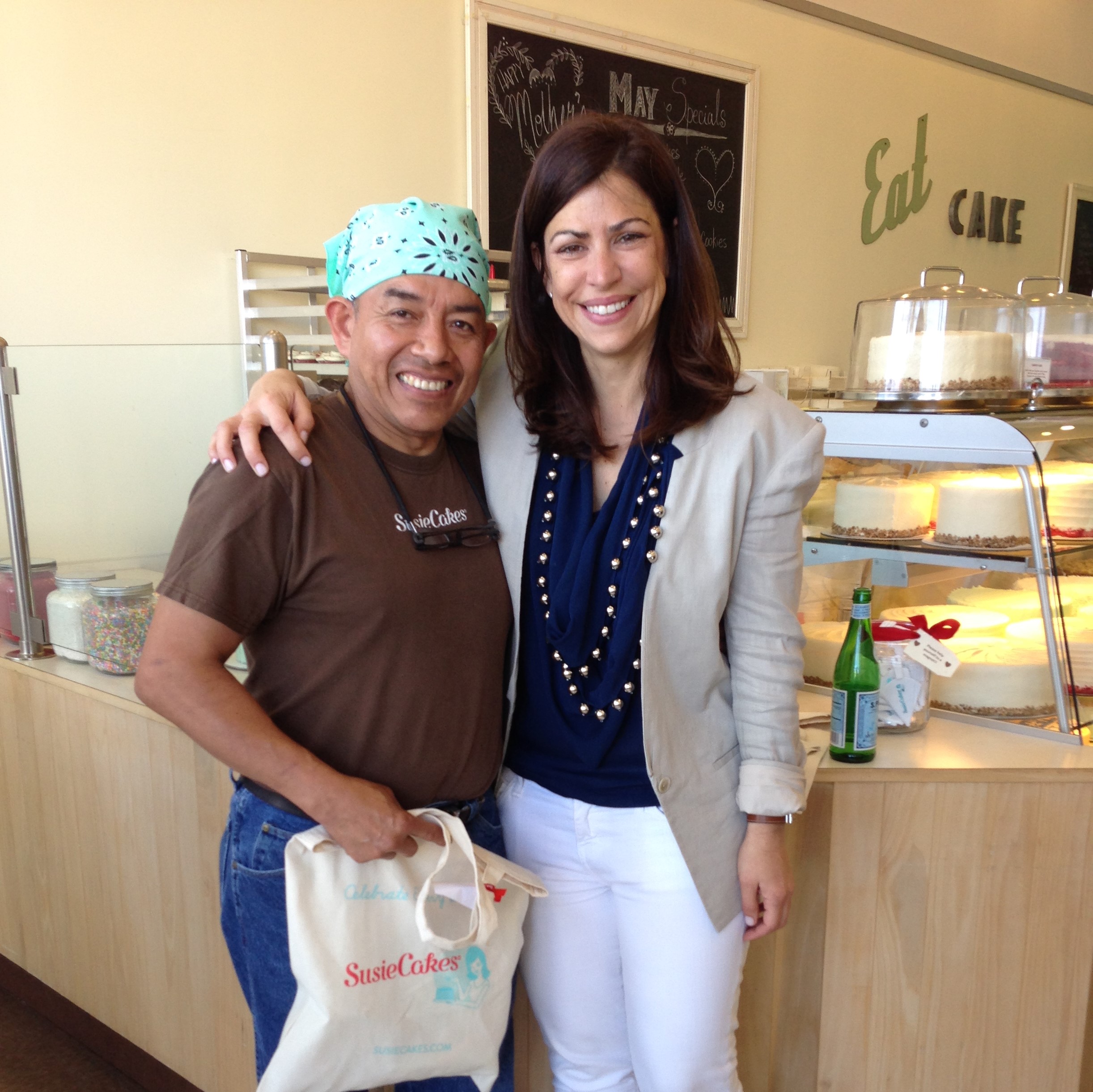 Two people smiling in the bakery.