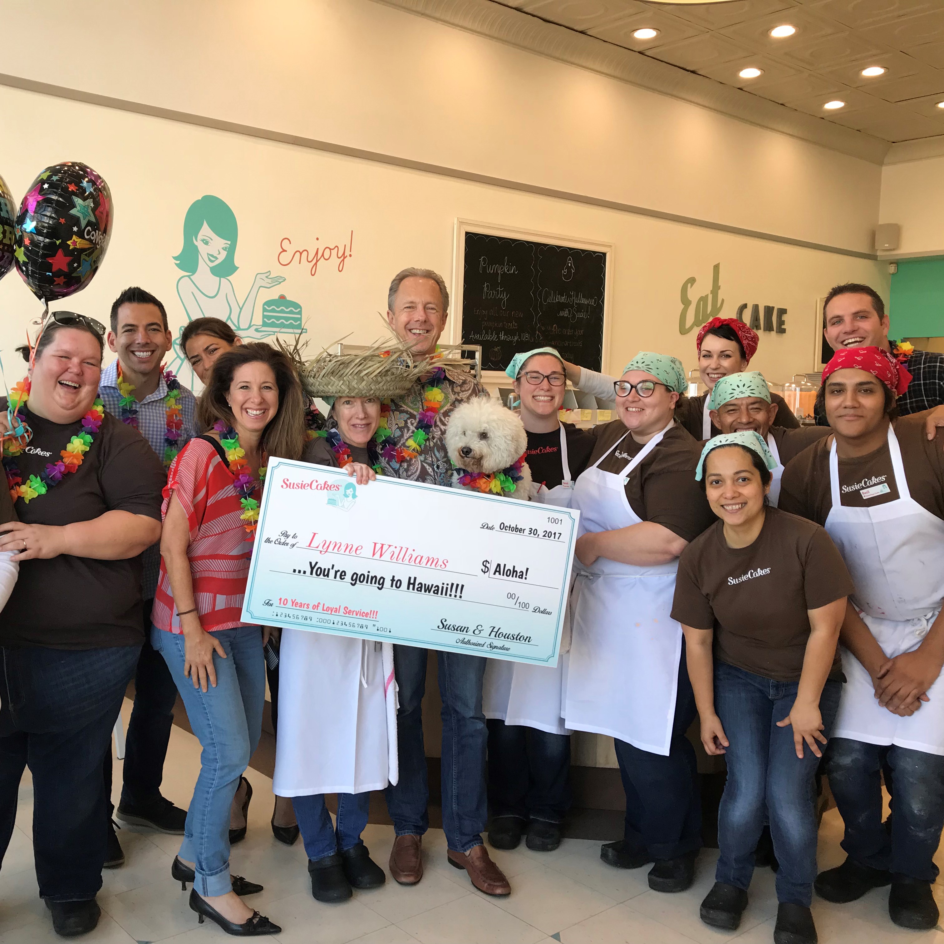 Group celebrating with a large check.