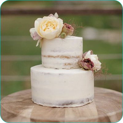 Two tier white wedding cake with flowers