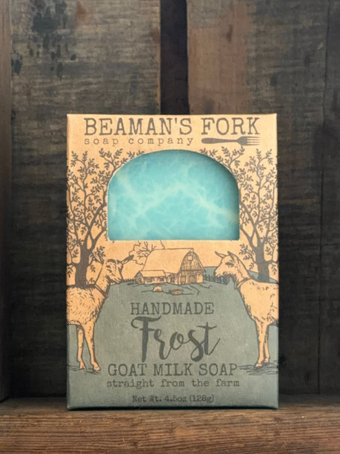 Frost Goat Milk Soap bar on rustic wooden surface