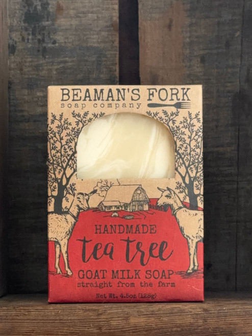 Tea Tree Goat Milk Soap bar on rustic wood